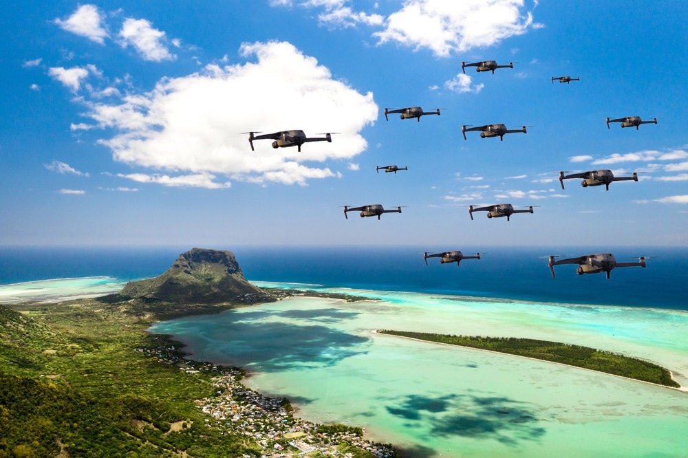 Drones fly over the island of Mauritius in the Indian Ocean. A natural landscape with drones flying over it. quadrocopter.