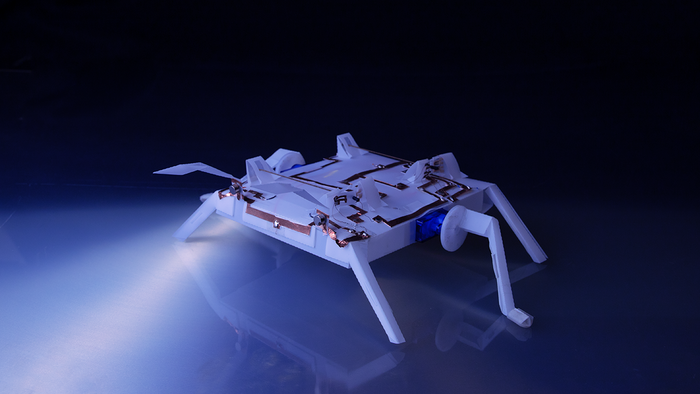 Chip-Free Origami-Inspired Robots for Use in Space and Surgery