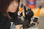 Wrist-Mounted Robot Enhances Grasping Motion of the Human Hand